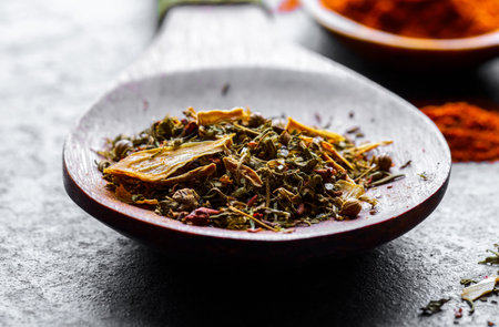 Spices for cooking with kitchen accessories on an old backgroundの写真素材