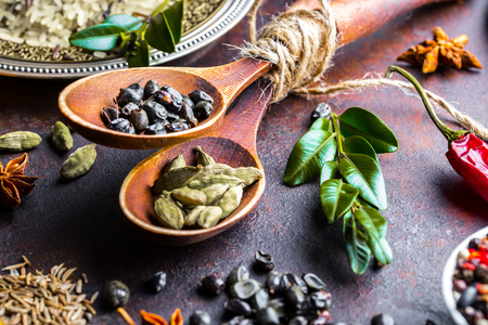 Spices for cooking with kitchen accessories on an old backgroundの写真素材