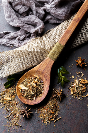 Spices for cooking with kitchen accessories on an old backgroundの写真素材