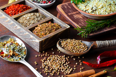Spices for cooking with kitchen accessories on an old backgroundの写真素材