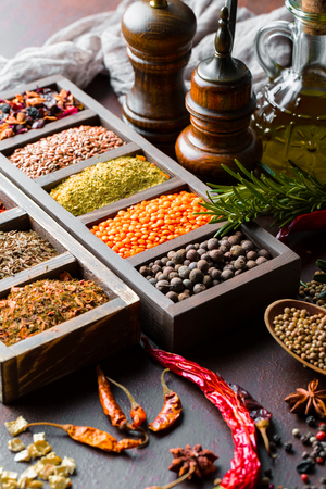 Spices for cooking with kitchen accessories on an old backgroundの写真素材