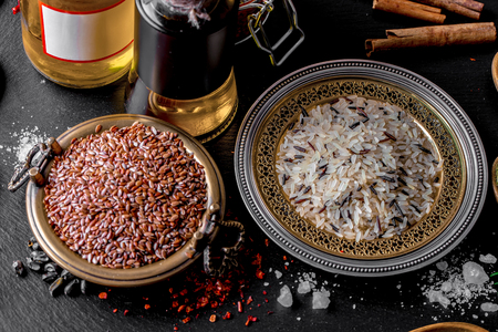 Spices for cooking with kitchen accessories on an old backgroundの写真素材