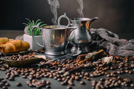 Coffee in a cup and saucer on an old background.の写真素材