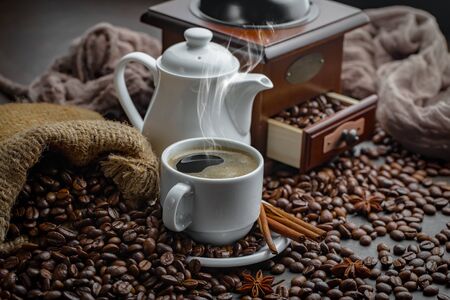 Coffee in a cup and saucer on an old background.の写真素材