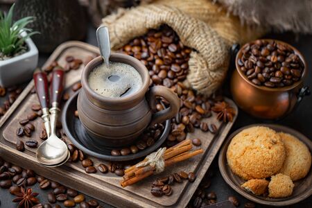 Coffee in a cup and saucer on an old background.の写真素材