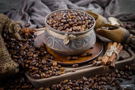 Coffee in a cup and saucer on an old background.の写真素材