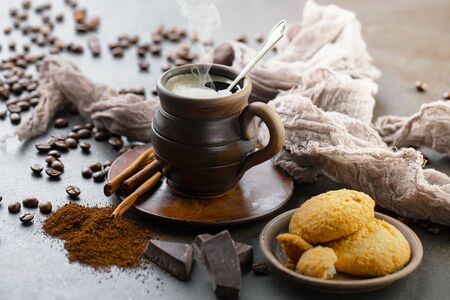 Black coffee on an old background in a cupの写真素材