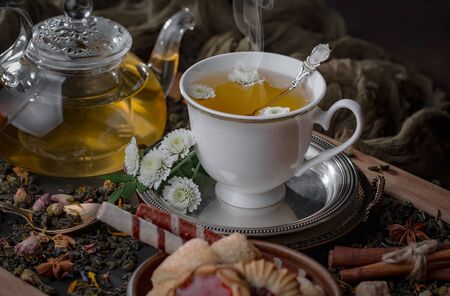 Tea in a cup on an old backgroundの写真素材