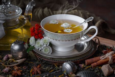 Tea in a cup on an old backgroundの写真素材