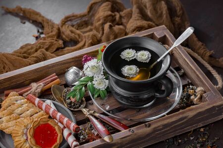 Tea in a cup on an old backgroundの写真素材