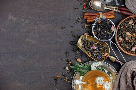 Tea in a cup on an old backgroundの写真素材