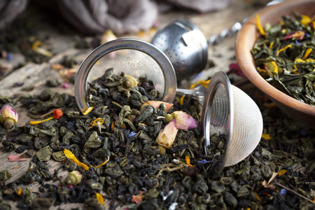 Dried leaf tea on old background