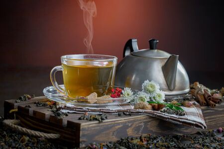 Tea in a cup on an old backgroundの写真素材