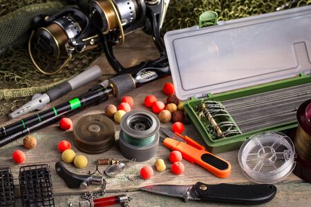 fishing tackle on a wooden table.の写真素材