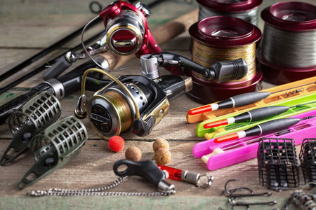 fishing tackle on a wooden table.