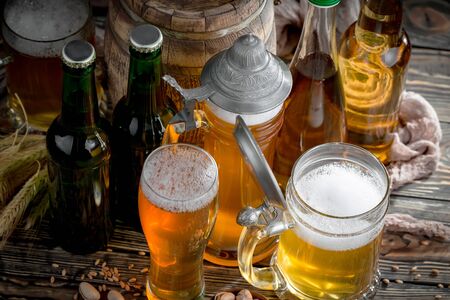 Light beer in a glass on the tableの写真素材