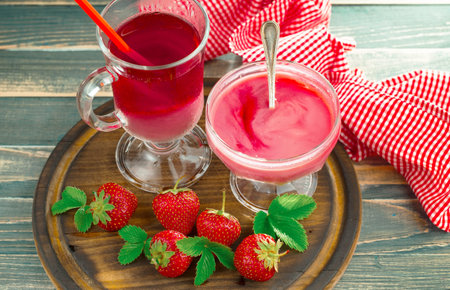 Sweet strawberry and healthy, wholesome food in composition on the table.