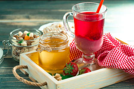 Sweet strawberry and healthy, wholesome food in composition on the table.の写真素材