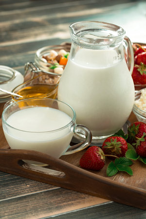 Sweet strawberry and healthy, wholesome food in composition on the table.の写真素材