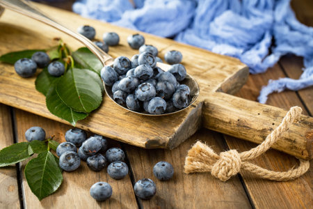 Fresh organic blueberries on wooden background. Selective focus. Copy space.の写真素材