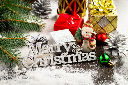 Merry Christmas greeting card. Festive decoration on wooden background. New Year concept. Copy...