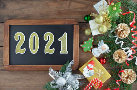 Merry Christmas and Happy New Year, postcard with gifts and Christmas decorations.の写真素材