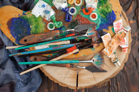 Paintbrushes and paints on a wooden background. Art conceptの写真素材