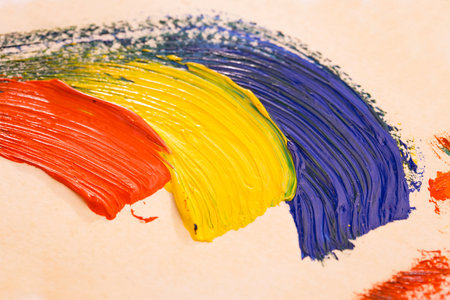 Colorful oil paint strokes on a white background close-up.の写真素材