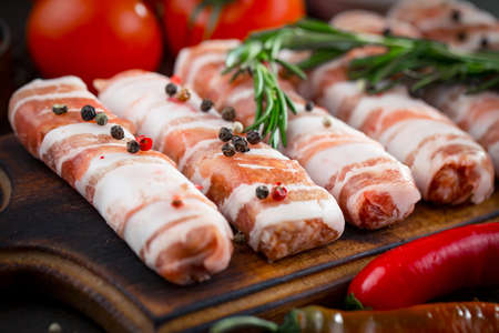 Raw meat with spices in a composition with kitchen accessories.の写真素材