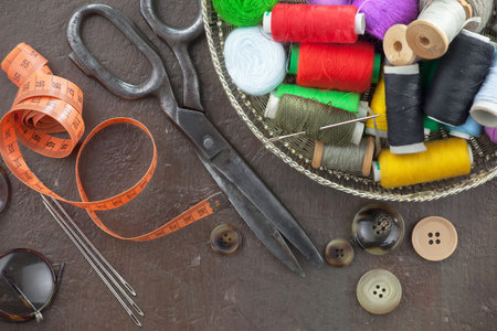 Threads, needles and sewing items.