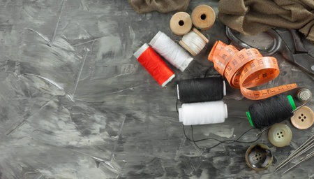 Threads, needles and sewing items.