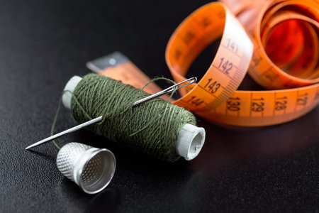 Threads, needles and sewing items.