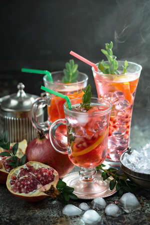 Refreshing summer alcoholic cocktail with crushed ice and citrus fruitsの写真素材