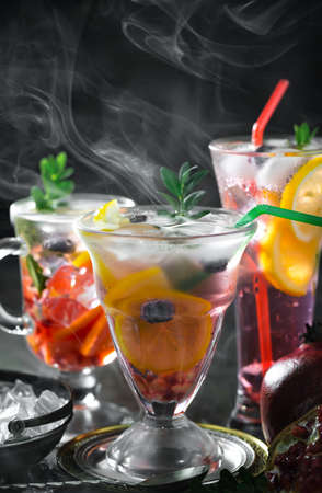 Refreshing summer alcoholic cocktail with crushed ice and citrus fruitsの写真素材