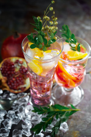 Refreshing summer alcoholic cocktail with crushed ice and citrus fruitsの写真素材