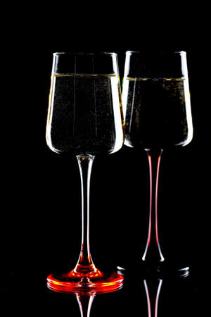 Glasses of wine on a black background.の写真素材