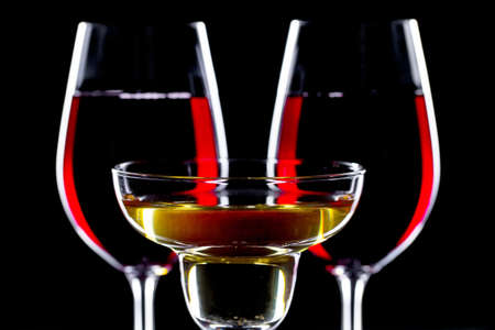Glasses of wine on a black background.の写真素材