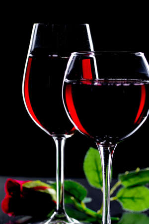 Glasses of wine on a black background.の写真素材