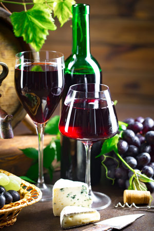 Wine in a glass on an old backgroundの写真素材