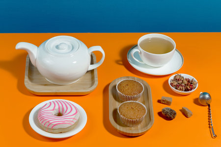 Tea with dessert on a bright colored backgroundの写真素材