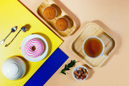 Tea with dessert on a bright colored backgroundの写真素材