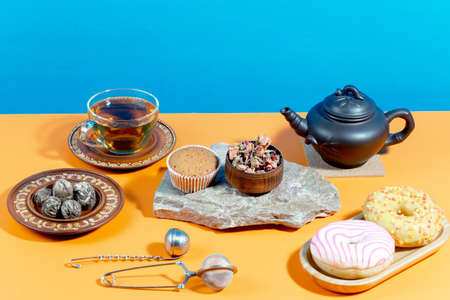 Tea with dessert on a bright colored backgroundの写真素材