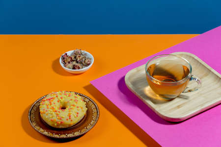 Tea with dessert on a bright colored backgroundの写真素材
