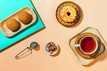 Tea with dessert on a bright colored backgroundの写真素材