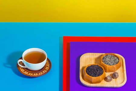Tea with dessert on a bright colored backgroundの写真素材