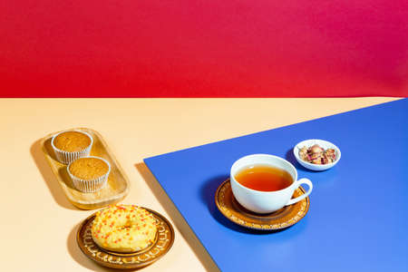 Tea with dessert on a bright colored backgroundの写真素材