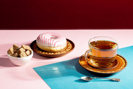Tea with dessert on a bright colored background