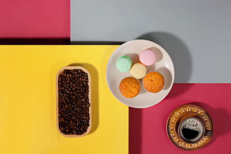 Coffee with dessert on a bright coloredの写真素材