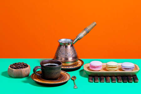 Coffee with dessert on a bright coloredの写真素材