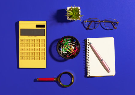 Items for business on bright colors in the office on the tableの写真素材